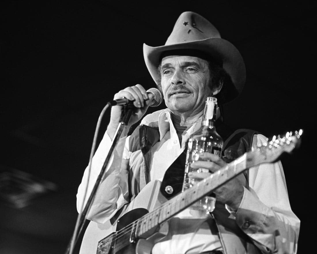 Man holding Microphone and guitar