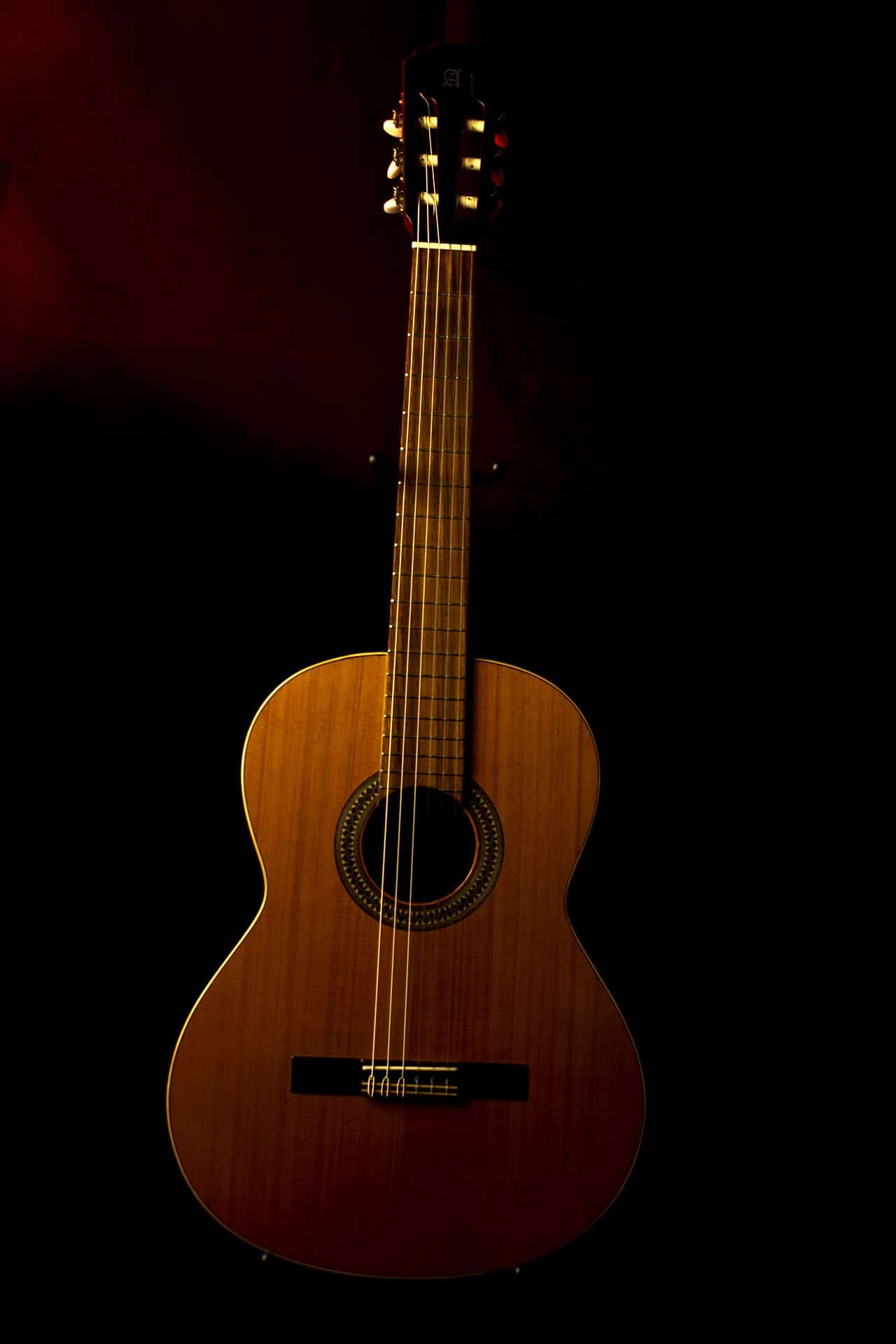 Modern acoustic guitar with a deeper and wider guitar body