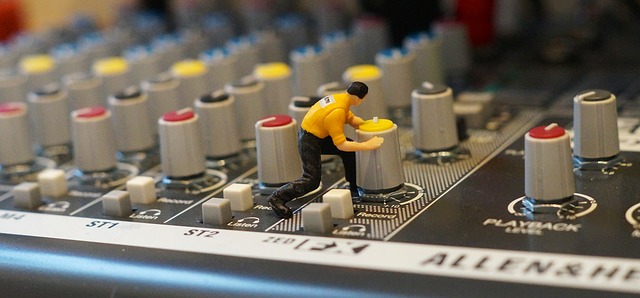 a man toy over the synthesizer